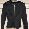 Black blazer with front zipper.