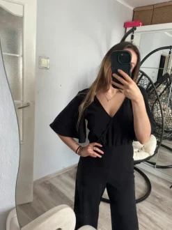 Czarny długi efektowny kombinezon z wycięciem V wow efekt impreza wesele