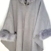 poncho with a faux fur trim on the hood and cuffs.