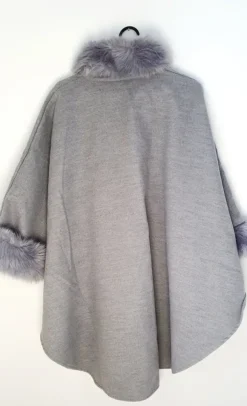 poncho with a faux fur trim on the hood and cuffs.